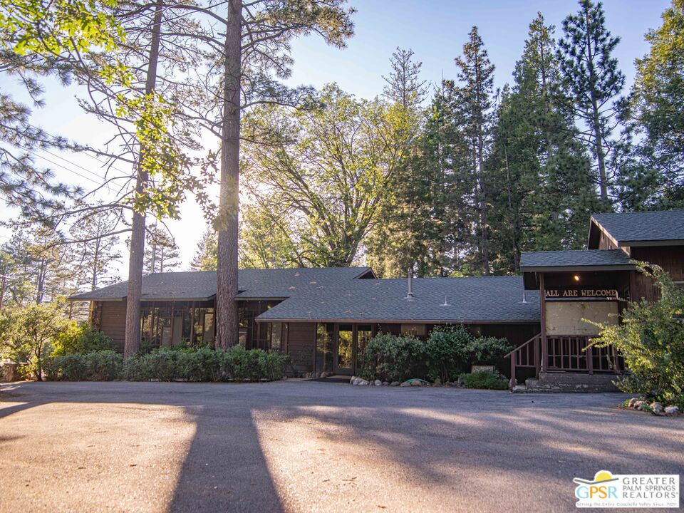 A rare and creative opportunity in the heart of Idyllwild, this architecturally unique former church is full of character and midcentury charm. Built in 1956, the structure spans 3,248 square feet on a .24-acre lot with R-3A zoning. It's a great fit for a daycare, community space, or residential conversion (see provided renderings).The midcentury details really stand out here-soaring ceilings, clean lines, and those colorful panel-stained glass windows that pour in light and give the whole space a warm, welcoming feel. The layout includes a formal lobby, three half-baths, several versatile rooms, and plenty of storage, offering flexibility for all kinds of creative or commercial ideas.Out back, there's a private courtyard for outdoor gatherings or quiet moments. And just across the street, Strawberry Creek adds a peaceful, natural element to the setting. All of this is just steps from the center of town. Properties like this don't come along often. This one has soul and endless potential.
