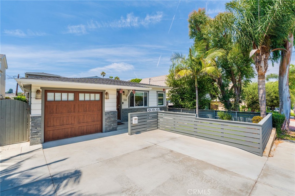 Nestled in the desirable Tree Section of Manhattan Beach.
Custom-built in 2015 with luxury finishes and entertaining in mind, this fully furnished home blends sophisticated design with thoughtful functionality.
As you step inside, you’re greeted by custom maple floors and a chef’s kitchen featuring an expansive 11' x 4' White Rhino marble island. This culinary space boasts a six-burner stove + griddle, double ovens, abundant cabinetry by Coastal Cabinets, a large farm sink, under-counter lighting, skylight and Arabesque backsplash with marble accents. A built-in breakfast bench with storage and a concrete table creates the perfect nook, the island has three swivel barstools.
Adjacent to the kitchen is a built-in bar with glass-front cabinetry, Black Galaxy marble counters, custom mirrored backsplash, and accent lighting.
The living room features custom white shelving with navy alligator wallpaper backing, a Bardiglio gray marble gas fireplace, and integrated speakers throughout the home. Floor-to-ceiling NanaWall glass doors open completely to create a true indoor-outdoor flow. Outside, enjoy a brand-new Trex deck with cable railing.
Descending from the deck, the backyard offers a private 5-hole putting green by Back Nine Greens and a secluded Jacuzzi.
Dedicated laundry room with sink and counter space, Two-car garage with Elfa shelving and side access to an outdoor shower—perfect after the beach or spa
First Bedroom: Plush carpet, hand-painted mermaid wall, bunk beds, and an Elfa closet. Lower Level Guest Suite: Maple floors, queen bed, built in desk, large closet, ceiling fan, and French doors to the backyard. The bathroom features penny tiles, marble countertop, and large glass shower. Lower Level Office: Custom pink wallpaper and oversized desk
Primary Suite (Upper Level)
Vaulted ceilings, plush carpet, Elfa closet system, Eastern King bed with custom tufted headboard, sitting bench, 55" smart TV, and French doors to a Juliet balcony overlooking the backyard. The spa-inspired ensuite bath features dual marble vanities, vaulted ceilings, bubble jet tub beneath a custom shell chandelier, separate glass shower with cobblestone floor, walk-in closet, private water closet, and bidet.
Stainless steel appliances. 8-foot interior doors throughout. Central A/C and heating. Reverse osmosis water filtration system. Ice maker and wine fridge. Custom window treatments and chandeliers. ADT security system, Ring doorbell & chimes.