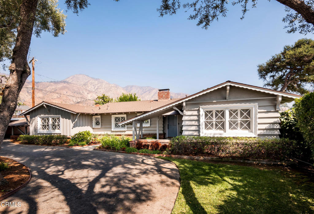 Character and timeless charm come together beautifully in this inviting 1955 Northeast Pasadena residence. Featuring 3 bedrooms, 2 bathrooms, a den, and 2,359 square feet, this home exudes warmth, comfort, and pride of ownership throughout. The moment you step inside, you'll notice the meticulous care and attention this home has received over the years. The spacious living and dining areas feature striking beamed ceilings, a cozy fireplace, gleaming hardwood floors, and picture windows framing views of the lush backyard. The renovated kitchen blends classic style with modern convenience, showcasing sleek contemporary finishes and a cheerful breakfast nook--perfect for enjoying your morning coffee.Designed with entertaining in mind, the floor plan flows effortlessly into a generous den, complete with its own fireplace--ideal for cozy evenings, movie nights, or game-day gatherings. The primary suite offers a serene retreat with its charming dressing area, walk-in closet, and a luxuriously updated bathroom. The second bathroom has also been thoughtfully renovated, featuring elegant finishes and modern fixtures that complement the home's classic character.A light-filled sunroom just off the living area provides a flexible space for relaxing, entertaining, or working from home. Step outside to your private backyard oasis, where mature landscaping and peaceful surroundings create the perfect backdrop for outdoor living. Nestled in the scenic foothills, just minutes from Pasadena's vibrant shops, dining, and cultural attractions, this home offers the perfect blend of tranquility and convenience.