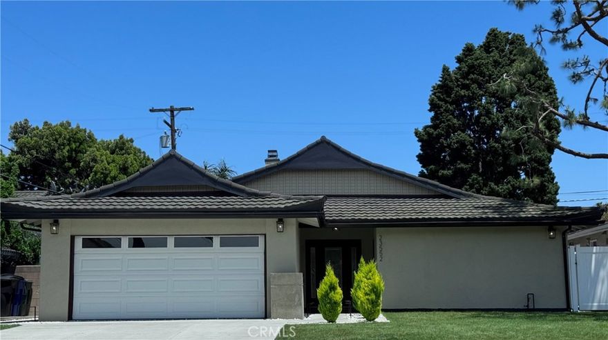 Beautifully upgraded single-story home featuring 4 spacious bedrooms and 2 fully remodeled bathrooms. This residence offers an open great room concept with a grand living and dining area separated by a stylish dual-sided fireplace. The upgraded kitchen boasts modern finishes, while newer flooring flows seamlessly throughout the home. Both bathrooms have been fully upgraded with contemporary touches. Enjoy a nice-sized backyard perfect for entertaining or relaxing, all set on a quiet, peaceful street.