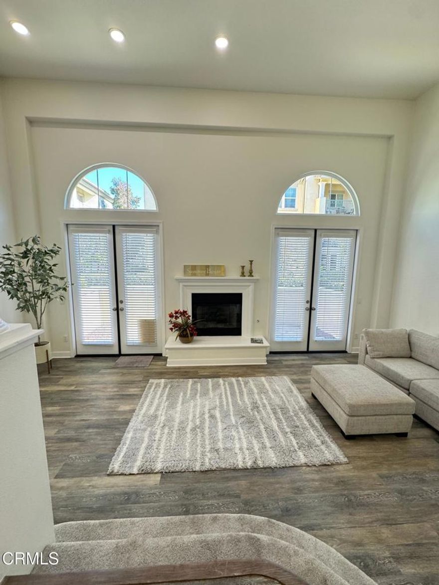 Come see this affordable, move-in ready, END UNIT townhouse with direct-access DOUBLE GARAGE in a gated marina community  called Westport, near Mandalay Shores Beach!  You get the amazing benefits of both beach and harbor lifestyles here and can either walk along the scenic waterways to cafes, restaurants and shopping or visit the sandy beach.  The step-down living room has an impressive 15' ceiling, gas fireplace with raised hearth and two sets of French doors to a sunny patio.  The main level features an open kitchen layout with island, dining area and family room, also a half bath and kitchen balcony.  All three bedrooms and two full baths are on the top floor and the primary suite includes two walk-in closets, a large spa-like bathroom and another balcony.  Recent remodeling includes new custom paint and baseboards throughout, new carpet on stairs and bedroom level, LVP wood-like flooring, GE stainless steel appliances.  Very light and bright with many windows and a light, neutral color palette that's easy to work with as you make this your perfect vacation or full-time home!  Heated pool and spa, too.