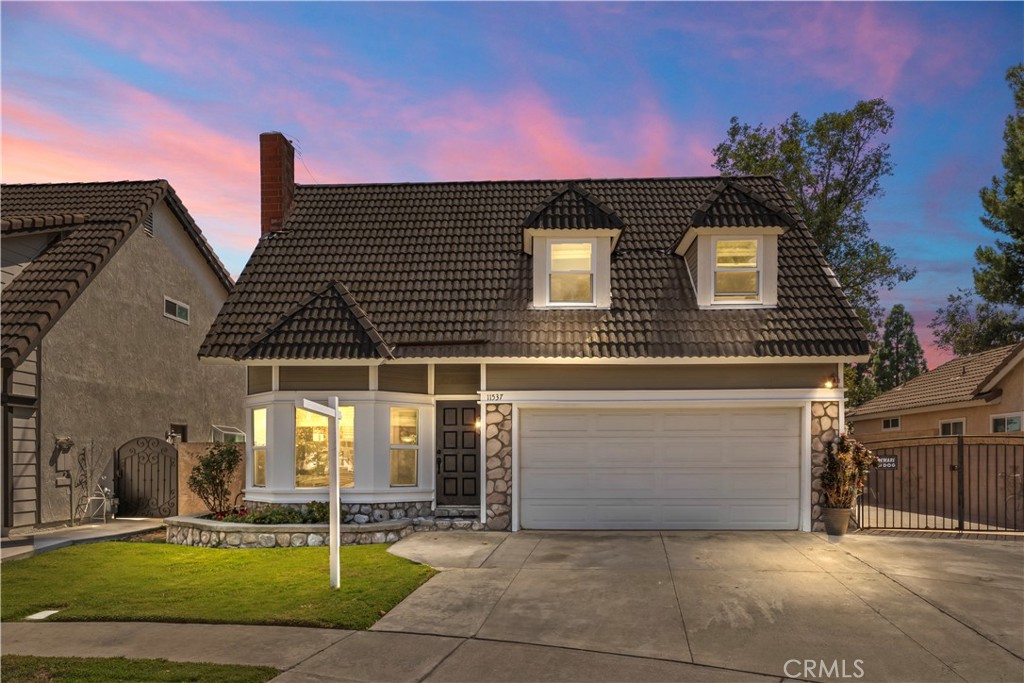 North of the 210 freeway, this wonderful Rancho Cucamonga home in the Vintage Highland neighborhood has hit the market! Ideally located within walking distance to Los Osos High School and Caryn Elementary, and close to parks, shopping, and dining, this property offers comfort, convenience, and a touch of nature. Located at the end of a cul de sac, this home features a versatile loft with a balcony and a 3 car driveway complimented by a gated cement slab; great for entertaining, extra parking, or even parking your recreational vehicles. Step inside to be greeted by porcelain tile flooring along the entire first floor. You'll also find a lovely bay window, a fireplace reaching from the floor to the ceiling, and a built in book case. This home features new flooring upstairs and on the stairs, newer windows, and partial roof updates for added peace of mind. The natural light that comes in from the home is so intense, you'll think the lights of the home are actually on. Enjoy your spacious backyard complete with an apricot tree, boysenberry and blackberry trees, two orange trees, and an apple tree—your own mini orchard. Whether you're looking for your dream home or a new investment property to add to your portfolio, look no further! Don't miss out!