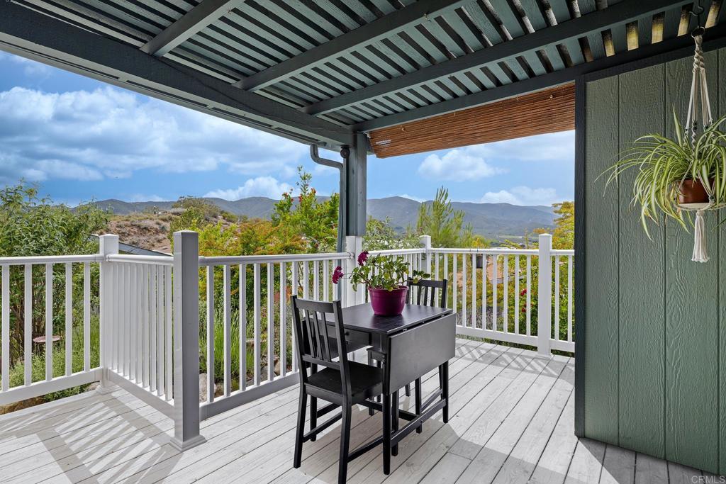 Price improvement! Take advantage of this updated value for one of the best-located homes in the 55+ Stone Ridge community with panoramic views. Indulge in one of the larger homes in the desirable 55+ Stone Ridge community of Warner Springs—where you own the land, no space rent! This well-maintained home is ideally located within the community to capture breathtaking views of the surrounding mountains and nearby award-winning wineries. Tucked behind a charming front wall for added privacy, the outdoor space features a peaceful patio porch—perfect for sipping morning coffee or enjoying a glass of local wine while soaking in the scenery. The garden area adds a serene spot to relax or entertain. Inside, you'll find a bright and spacious living room that flows seamlessly into the dining area and kitchen, complete with a gas stove, water softener, and drinking water filter. A cozy family room or den offers great flex space—ideal for a home gym, hobby room, or guest lounge. The large primary suite features both a soaking tub and separate shower. The second bedroom is generously sized with convenient access to a full bath and laundry room. A back entrance with a ramp offers easy access, and outside you'll find 3 covered carport spaces, 2 storage sheds, and plenty of room for your needs. Community amenities include a swimming pool and spa, outdoor gym, clubhouse with kitchen, billiards, and more—all nestled in a tranquil country setting with picturesque vineyard and mountain views. Don’t miss this special opportunity to enjoy comfort, community, and the beauty of Warner Springs!