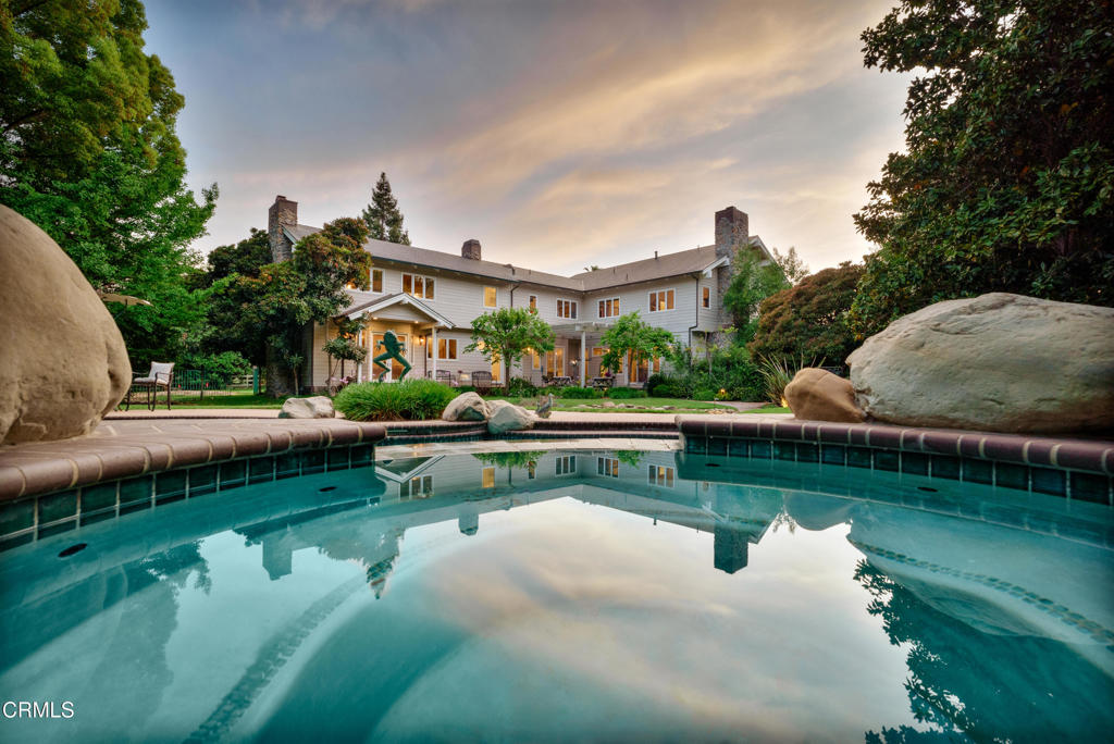 Spectacular Addition & Remodel 2024 ROYAL OAKS--Ojai--A Rare Opportunity to acquire this prestigious 5.33-acre, 6,000-sq-ft with 1,800-sq-ft, six-car garage, gated estate. This is Location, Location. Location surrounded by lush, mature landscaping, which offers serene privacy, as well as convenience as it is hidden in the heart of downtown Ojai. The addition/remodel presents a luxurious modern farmhouse featuring Italian Appliances, Brazilian Stone, Buck-Skinned Wood, Marble Slab Showers, Marble and Travertine Flooring, Doug Fir Beams & Detail, Cedar Siding (think Hamptons), with consideration for detail and extensive architectural appeal throughout created by top designers with benefit & security of the Smart home features and secured location within a private community. Topped with a stunning all-copper roof! Two Primary Suites, four fireplaces, Library, Media, Living and Family Rooms, also a Wine Cellar with Tasting Room and even a Massage Room, then there's the 1,800-sq-ft, six-car garages and workspace (easily convert a portion to ADU or ?). Moving outside, the extensive landscaped grounds are supported by the private well. Then, of course a pool/spa, bocce, volleyball court, numerous gazebos and gathering spaces, a family orchard, and even a nine-hole putting green and driving range. The beautiful grounds are integrated in the home's living via the many custom windows through which you're able to enjoy the entire property and views of Topa Topa & Black Mountain.This is a foundation for a truly discerning lifestyle.