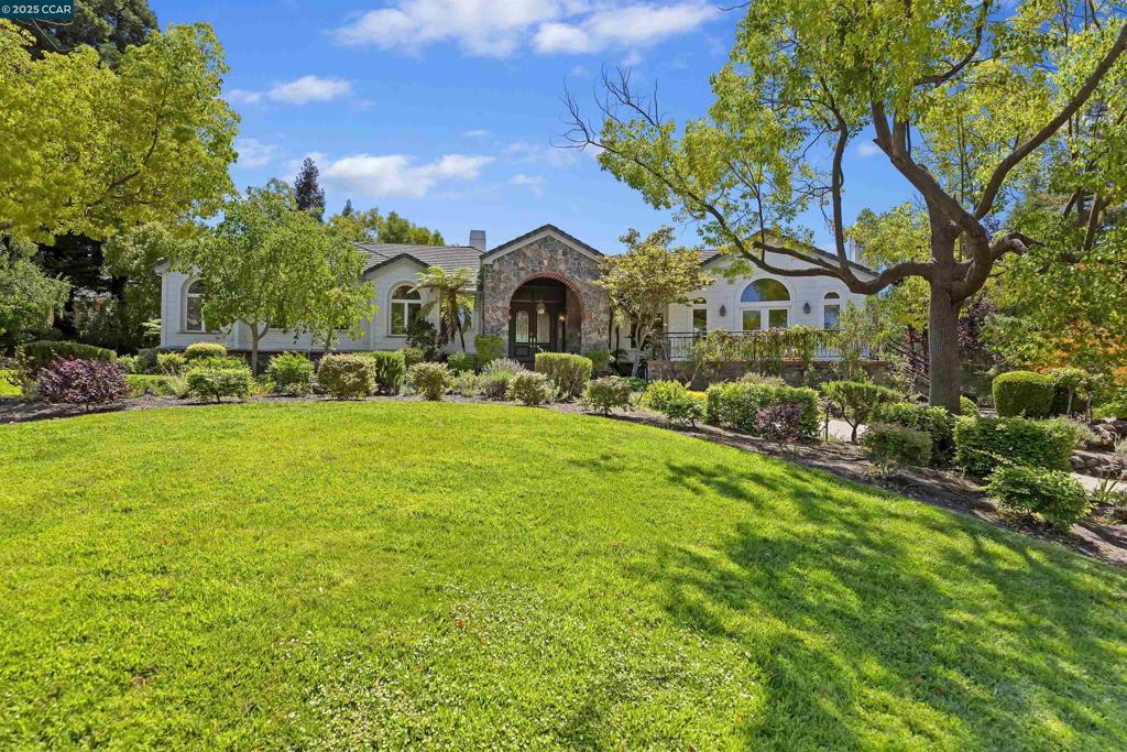 Stunning, custom built contemporary home ideally located in the exclusive Greenhills neighborhood with top Lafayette schools nearby. Gracious public rooms are bathed in natural light and framed by pastoral views, with grand proportions, lofty ceilings, and architectural drama. Lovely outdoor setting features expansive lawn, attractive decks, and sparkling private pool. Spacious kitchen is a gourmet’s delight with large central island, quality stainless steel appliances, abundant cabinetry and expansive stone counters. Primary suite is a true retreat with fabulous walk-in closet, private balcony, fireplace that serves both the bedroom and the spa-like bathroom with its jetted tub and huge walk-in shower. Well appointed family room adjoins the kitchen; spacious rec/play room opening to fifth bedroom could also serve as ideal in-law quarters.