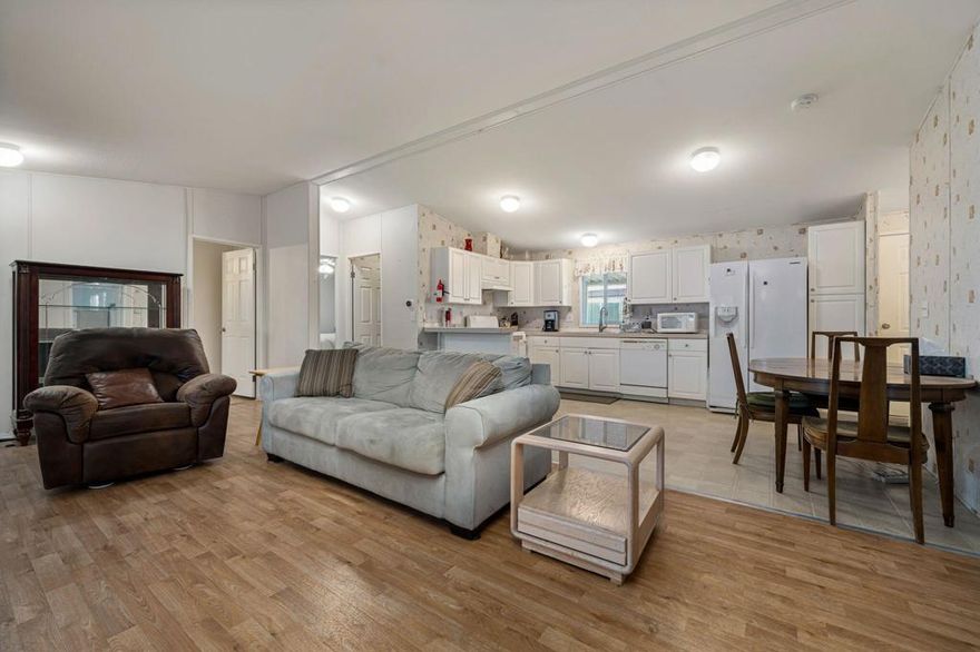 Welcome to this beautifully maintained three-bedroom, two-bathroom home offering comfort, accessibility, and style. The spacious open floor plan is perfect for modern living, featuring wide entryways and thoughtful accessibility throughout. The updated HVAC system ensures year-round comfort, while the bright and inviting living spaces flow seamlessly into a well-appointed kitchen and dining area. Each bedroom is generously sized, and the primary suite includes a private bath for added convenience. Outside, enjoy a good-sized yard--ideal for gardening, relaxing, or entertaining. This move-in-ready home combines function and charm in one perfect package. Home as a Wheel Chair Ramp.