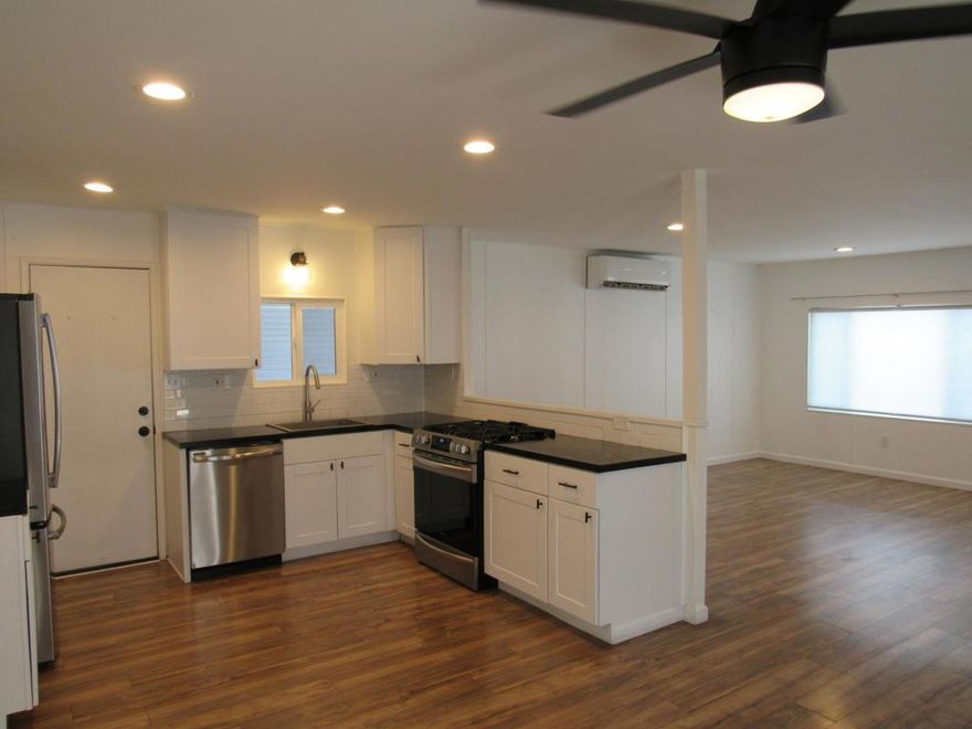 Bright, open and impressively upgraded, this turnkey home is located in the heart of Palm Springs Mobile Club in South Palm Springs. Showcasing the attributes of a 1969 Royal Lancer, the fully renovated residence has everything needed to enjoy carefree indoor/outdoor living. An expansive covered lanai creates a welcoming vibe and provides the ideal spot for entertaining friends and neighbors, enjoying a cocktail after sunset, and simple relaxation. White vinyl fencing, mature plantings, refreshed landscaping with newer irrigation, and graceful palm trees embrace the homesite, which also features a covered carport for maximum convenience. Indoors, large dual-pane windows, French doors and sliders allow natural light to illuminate living areas that extend approximately 1,200 square feet. Enjoy a spacious living room with neighborhood views, a dining room with access to the patio, two bedrooms and two stylish baths. Generously complementing mealtime and party time, the open kitchen shines with newer stainless-steel appliances, glossy black countertops, white Shaker cabinetry, a full tile backsplash, and a door to the carport. Both bedrooms open to the patio, baths display vessel sinks, interior laundry is included, and closets feature built-in shelving. Every detail has received special attention, including woodgrain plank flooring, recessed lighting, ceiling fans, newer interior doors, and newer drywall and trim. Behind the scenes awaits all-new plumbing and electrical systems, newer insulation, an updated water heater, and multi-zone high-efficiency mini-split heating and cooling systems. Residents at Palm Springs Mobile Club enjoy a gated setting with breathtaking mountain views, no age restrictions, and a location protected from wind. A freshly renovated clubhouse reveals a pool, spa, fire pit, billiards room, lounge, gym and kitchen. Homeowners also appreciate the advantages of an enclosed dog park, shuffleboard court, and a full calendar of fun-filled social events. Miles of scenic hiking trails await in Indian Canyons, shopping centers are nearby, and downtown Palm Springs' restaurants, galleries and clubs are moments from home. Space rental is $1,250 per month and includes water, trash and sewer. Schedule your private tour today, and discover the ideal blend of classic Palm Springs style and modern resort living