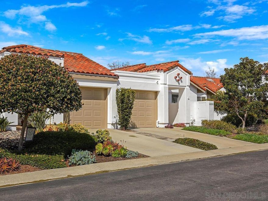 Welcome home to Ocean Hills Country Club, an active 55+ community with resort style living and amazing amenities. Escape the cold winters and enjoy the year-round mild climate.  This rare Delphi 1 model is ready to make it your own, whether as your primary or as a second home. Enjoy 921 square feet, a spacious primary bedroom with ensuite bathroom, and a second bedroom plus a powder room. Features include Anderson retrofitted dual pane, dual function windows and 2 retrofitted sliding glass doors. Vaulted ceilings create a feeling of a much larger space. The efficient kitchen and airy living room both open up to side patios, professional hardscape, and low maintenance landscaping. The artificial turf lawn could easily be a putting green. There is also an oversized one car garage with direct access to this home. Laundry facilities are located inside for convenience. Don't forget to tour the Clubhouse amenities and take note that there is a no fees executive golf course, free RV onsite lot, 8 pickleball courts, 3 tennis courts, plus more than 40 social clubs, groups and so much more.  Ocean Hills Country Club is the premier, gate guarded 55+ active living community in south Oceanside, California. This community offers something for everyone! The 27000 sqft clubhouse hosts, dances, concerts, and constant year-round events. In fact, if your interest group is not represented, then you can start a group. Right now, there are about 40 clubs and groups ranging from golf, pickleball, tennis, bocce, RV, pool, billiards, sewing, crafts, cardmaking, oil and watercolor painting, photography, genealogy, fitness, mahjong, bridge, line dance, ballroom, a few dance clubs, several wine clubs, wood working, hiking, and  yoga, just to name a few! You will love Ocean Hills. OH...This is a pet friendly community too.