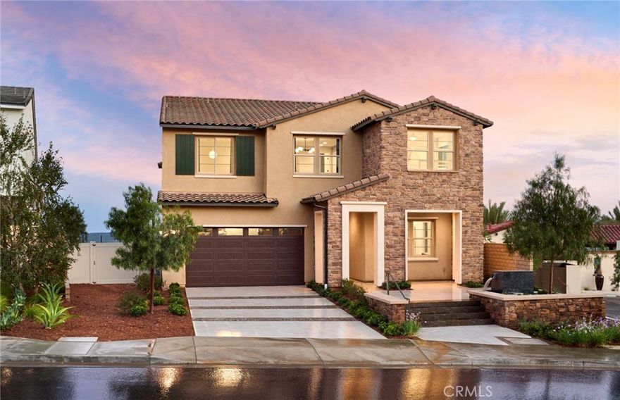 The beautifully crafted Plan 3 model home leaves a lasting impression with an expansive great room, offering views of a large luxury outdoor living space including an infinity pool and spectacular city views of Los Angeles! This five-bedroom home offers a spacious kitchen and a bright casual dining area with a walk-in pantry and trending wet bar that is perfect for entertaining. Highlighting the large primary bedroom suite with a generous walk-in closet and a lovely primary bath with separate vanities and a large soaking tub. Secondary bedrooms, three with a walk-in closet, are spacious and feature private baths. The Plan 3 also offers accessible laundry with lots of cabinet space and under stair storage! Conveniently located next to the Canyon Club featuring a breathtaking resort style pool and amenities.