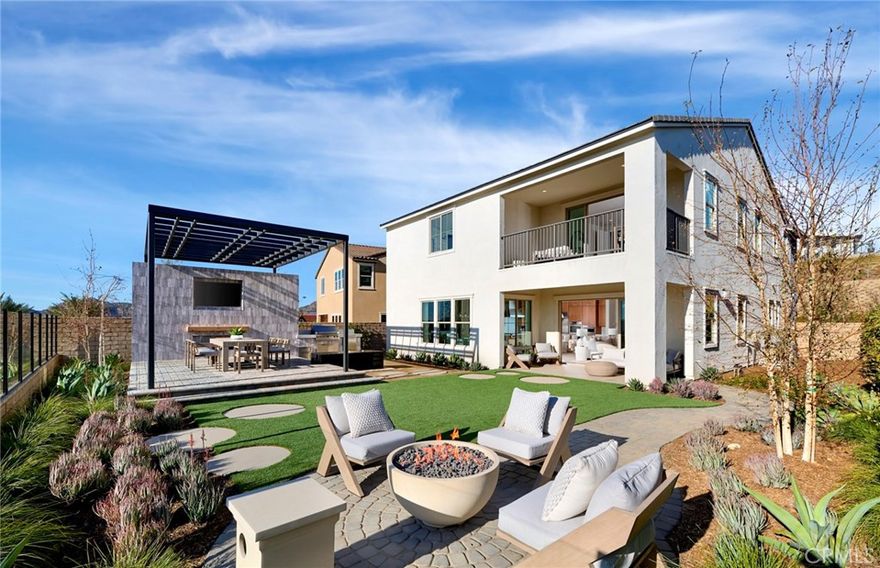 The beautifully crafted Plan 3 model home leaves a lasting impression with an expansive great room, offering views of a large luxury outdoor living space including an infinity pool and spectacular city views of Los Angeles! This five-bedroom home offers a spacious kitchen and a bright casual dining area with a walk-in pantry and trending wet bar that is perfect for entertaining. Highlighting the large primary bedroom suite with a generous walk-in closet and a lovely primary bath with separate vanities and a large soaking tub. Secondary bedrooms, three with a walk-in closet, are spacious and feature private baths. The Plan 3 also offers accessible laundry with lots of cabinet space and under stair storage! Conveniently located next to the Canyon Club featuring a breathtaking resort style pool and amenities.