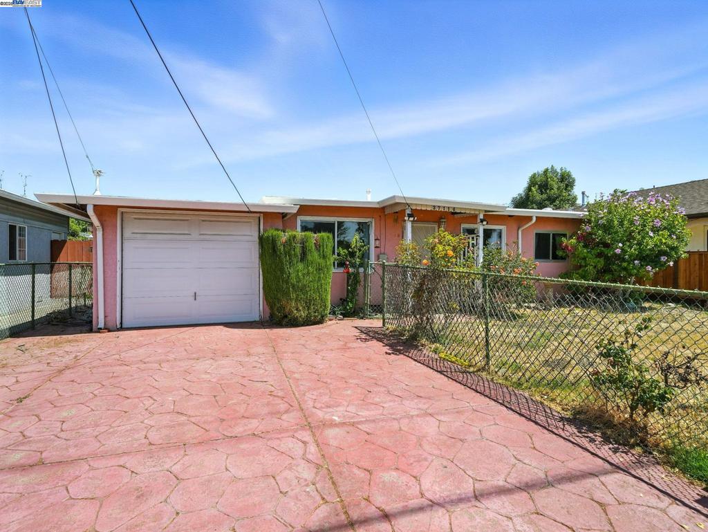 This Fremont home offers a unique opportunity to blend comfort with customization. Combining original character with thoughtful updates, it features new flooring, fresh interior paint, and a remodeled bathroom—providing a solid foundation for your personal style. The spacious backyard includes mature peach and orange trees, a grapevine, and a detached bonus room—ideal for a gym or game room. With convenient access to schools, parks, shopping, and commuter routes, this property offers flexible living in a well-connected location.