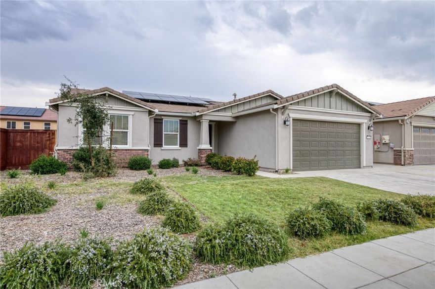 Come visit this beautiful 3-bedroom, 2-bath single-story home built in 2022! Featuring an owned solar system, tile roof, this move-in ready home offers an open-concept floor plan with modern finishes throughout. The kitchen boasts stainless steel appliances, a gas stove, LED lighting, and durable vinyl plank flooring perfect for cooking and entertaining.



Enjoy the convenience of indoor laundry on your way to the spacious 2-car garage. The primary suite includes a large bathroom and a generous walk-in closet. Additional bedrooms feature LED recessed lighting and cozy carpet.



Outside is the large backyard with a concrete patio, ideal for relaxing or hosting gatherings. With its modern design, energy efficiency, and thoughtful layout, this home truly has it all!