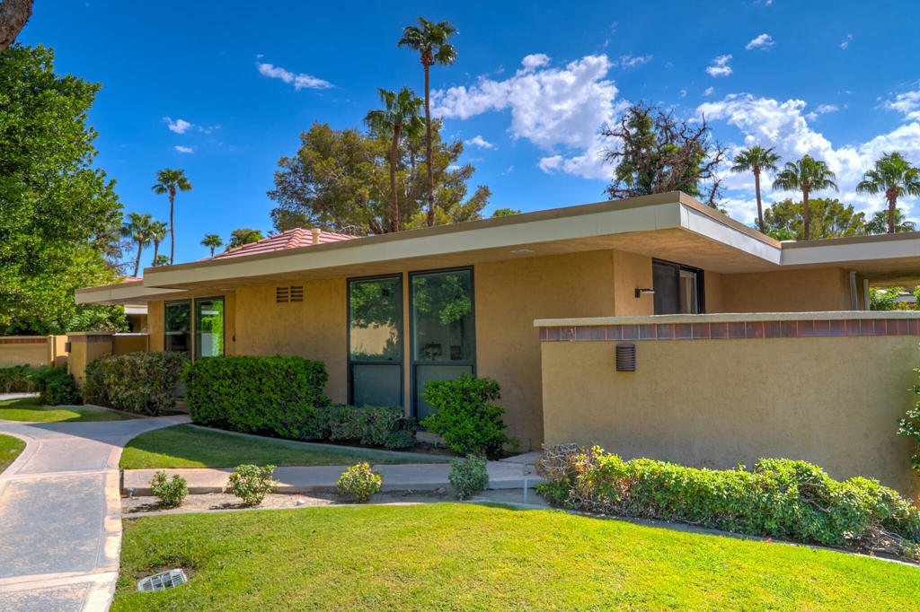 Tucked away in the Racquet Club Colony, once part of the exclusive Racquet Club, this single level, remodeled 'villa' blends iconic Palm Springs style with comfort and convenience. Offering 1083 ft. of light-filled living space, the residence features soaring ceilings, window and sliding glass doors that open to two spacious private patios, perfect for morning coffee or evening entertaining. Set in one of the community's most desirable interior locations, the home enjoys serene mountain views, proximity to covered parking, resort-style pool & spa, all while remaining sheltered from street noise. Inside, the flexible floor plan includes an expansive primary suite with direct patio access, plus a versatile bonus room easily adapted as guest space, office or den, complete with its own bath. The updated kitchen offers stainless steel appliances and an ideal pass-through for seamless indoor-outdoor dining. In-unit laundry room for convenience, and the gated community welcome pets with its own dog run. With just 20 residences, Racquet Club Colony is both intimate and exclusive, designed for timeless desert living. Whether seeking a personal retreat, seasonal escape, or in income producing investment, this property is a rare find in one of Palm Springs' most desirable enclaves.