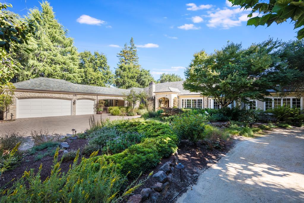A true masterpiece, crafted by highly respected Paul Mehus, Mehus Construction. Executive retreat nestled on a 2+ acre park like setting in the heart of Silicon Valley. A true master suite suite designed for the most discerning client. Lavish master bathroom, two spacious custom walk-in closets, private sleeping chamber and french doors opening to a terrace with a sweeping view. Unparalleled quality and attention to detail seen in every room of the house. Spa inspired bathrooms, custom woodwork, office with wood paneled walls and open wood box ceiling, herringbone design white oak hardwood floors, Millbrook custom stone fireplaces, meandering walkway to a Carmel style cottage in a storybook setting, multiple entertaining and lounging terraces, english style gardens with koi pond, sparkling pool and spa resting in a park-like setting with sport court, bocci ball court, and playground area. Finished lower level with full bath steam shower, exercise area, and home entertainment center.