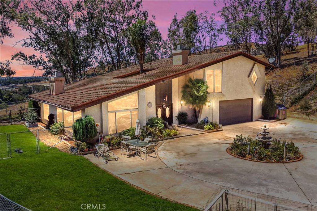 Custom-Built Hilltop Home with Panoramic Views of Banning. Perched on 1.24 acres with breathtaking, unobstructed views of the San Jacinto Mountains and San Gorgonio Pass too. This stunning custom home offers 4–5 bedrooms, 3 bathrooms, and 2,972 sq. ft. of versatile living space. Designed for comfort, style, and entertaining, this property is truly one of a kind. Step inside to a bright, open atrium that seamlessly connects the home’s spaces. The spacious living room features a cozy fireplace, while the beautifully upgraded kitchen boasts a newer stovetop, custom backsplash, and gorgeous granite countertops. The remodeled master bath serves as a spa-like retreat, complete with a large soaking tub and modern finishes. Additional features include: Flexible floor plan: 3 bedrooms and 2 bathrooms upstairs, plus 1 bedroom and bath downstairs. Bonus room upstairs is ideal for an office, craft room, or den. Large windows throughout the dining, living, and kitchen areas fill the home with natural light and showcase panoramic views. Back patio is perfect for entertaining or relaxing. Second garage/workshop has plenty of parking and storage, with potential to convert into a small ADU or workshop that already includes attached plumbing. Ample outdoor space. Circular driveway, private hilltop setting, and mature trees provide both privacy and charm. From sunrise to sunset, enjoy sweeping, unobstructed vistas from nearly every angle perfect for relaxing, entertaining, or simply soaking in the beauty of your surroundings. With space, style, and spectacular daytime and nighttime views, this home offers a rare opportunity to live in comfort and luxury in North Banning. Don’t miss your chance to own this exceptional property with space, style, and views that will take your breath away!