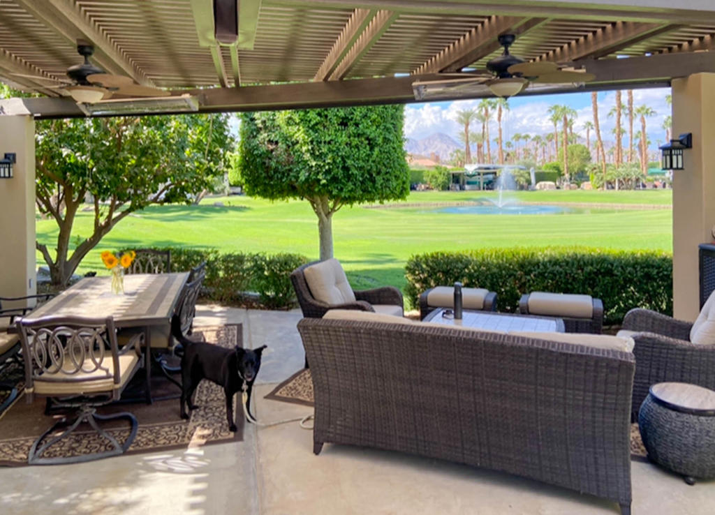 This beautifully appointed RV lot offers one of the most desirable locations at Outdoor Resort Indio, with sweeping views of the golf course, sparkling fountain, serene lake, charming bridge, and the majestic Santa Rosa Mountains. Designed with both comfort and style in mind, the lot feels exceptionally private while being just a short walk to the clubhouse and resort amenities.The L-shaped Alumawood pergola creates a shaded outdoor living space, complete with four ceiling heaters and four ceiling fans for year-round comfort. The spacious kitchen features granite countertops, custom covers, and a rolling BBQ--perfect for entertaining family and friends. Furnishings include a dining table with six chairs, wicker sofa and chairs, ottomans, and a rolling storage cabinet, all thoughtfully protected with custom covers.Additional upgrades include a water softener, custom lighting, and abundant seating options, making this lot move-in ready for the next discerning owner. Whether you're hosting a gathering under the pergola or relaxing by the lake at sunset, this property delivers the perfect blend of luxury and tranquility in one of the desert's premier Class A motorcoach resorts.ORI is a class A motorcoach community.