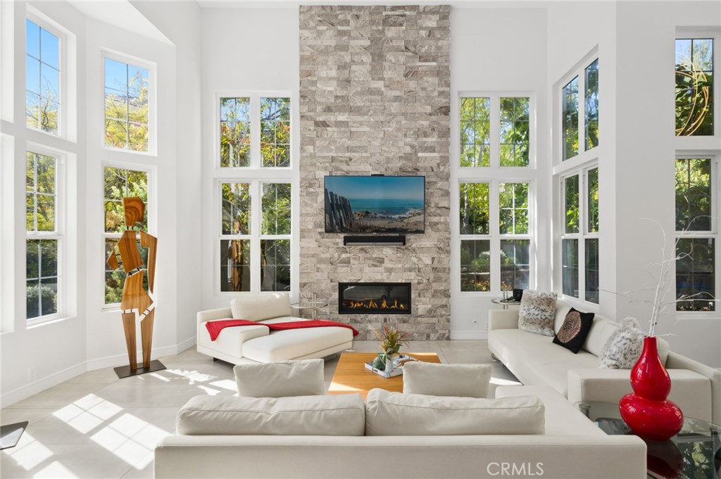 Nestled in the prestigious gated community of The Pointe in Newport Coast, this fully renovated 4-bedroom, 4-bathroom masterpiece at 3 Bridgeport redefines modern luxury. Spanning 3,007 sqft on a sprawling 9,748 sqft lot, this architectural gem boasts stunning curb appeal with a newly renovated entryway and driveway leading to a three-car garage. The home’s sleek, contemporary design features soaring vaulted ceilings, bi-folding doors that seamlessly blend indoor and outdoor living, and a spacious, state-of-the-art kitchen perfect for entertaining. Each bathroom has been meticulously updated with exquisite attention to detail. The expansive backyard is an entertainer’s dream, complete with a sparkling pool, a putting green, and ample space for relaxation. A sophisticated wine cellar adds a touch of elegance to this extraordinary residence. Experience unparalleled style and comfort in one of Newport Coast’s most coveted communities.