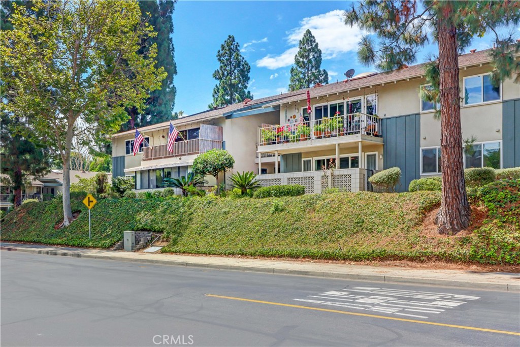 Serenity and tree tops views greet you when you walk into this well-loved beautiful home (2bd/2ba). The upstairs Casa Blanca model has a spacious living room and offers direct access to your oversized balcony. Enjoy the peaceful views while you drink your morning coffee. The primary bedroom has an en-suite bathroom and plenty of closet space. Your private en-suite bathroom has been remodeled with new cabinets, quartz countertop, new bathtub/shower and modern bathroom mirror with a hidden recessed cabinet. A stackable full sized washer/dryer also has been installed for your convenience. Other great features include double paned windows/sliding glass doors, laminate flooring, remodeled shower in guest bathroom, and an updated AC/heating wall unit. Conveniently located, this home is near Laguna Beach and offers easy access to all the community amenities such as: 27-hole golf course, tennis courts, separate pickle ball courts, five swimming pools, three fitness centers, seven clubhouses including Clubhouse 4 offering amazing classes in art, ceramics, wood shop, jewelry-making, and sewing, and much more. An added bonus, walk from your home to both Clubhouse 1 and 3. Whether you enjoy socializing with neighbors or pursuing your favorite hobbies, Laguna Woods Village offers something for everyone. The HOA includes water, sewer, trash, cable TV and landscaping. Don’t miss the opportunity to own a move-in ready home in the most sought after 55+ community in Orange County.