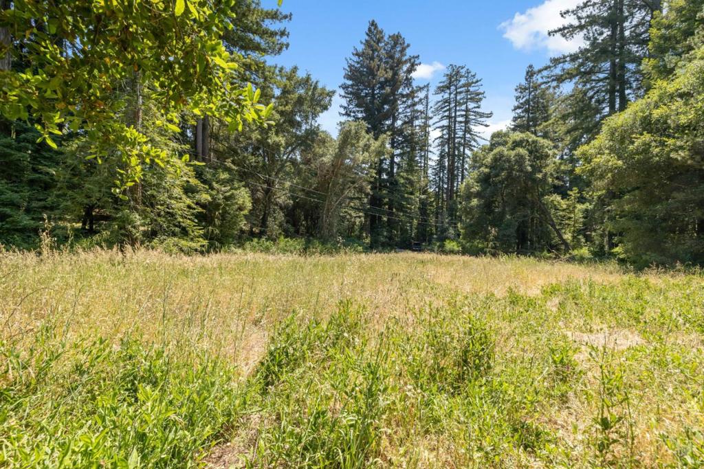 Its hard to capture the peaceful beauty of this property in photosits even more special in person. A gardeners delight! This sunny and private 2-acre lot in Boulder Creek offers the perfect canvas to build your dream home and create a thriving garden oasis. The former home was lost in the 2020 CZU firenow the land is cleared and ready for new beginnings. A recently paved driveway remains in excellent condition. Existing septic system with leach lines located in the lower open meadow. Power at the street and city water available. The potential home site is set back from the road for added privacy, surrounded by nature with mountain views and all-day sun. Easy paved access, minutes to downtown Boulder Creek, golf, and disc golf. A rare opportunity for builders, dreamers, and green thumbs alike. Easy commute to Silicon Valley or Santa Cruz. Don't miss this peaceful, sun-soaked slice of the Santa Cruz Mountains! Come experience the serenity, photos don't do it justice.