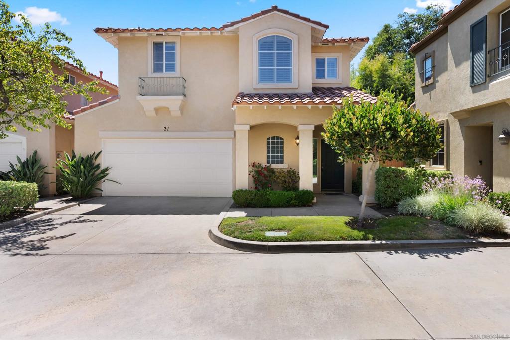 Welcome to your meticulously maintained detached townhome in the highly sought-after Fiesta neighborhood of Melinda Heights in Rancho Santa Margarita! This turn-key two-story home offers privacy, your own lush enclosed yard filled with beautiful blooming flowers and fruit, and a perfect blend of style, function, and comfort. Step into the inviting living room with soaring ceilings, abundant natural light, and a cozy gas fireplace—ideal for entertaining or relaxing. Adjacent is a dining area and kitchen. Direct access to the attached two-car garage makes unloading groceries a breeze. Upstairs, retreat to your spacious primary suite with a walk-in closet featuring custom built-ins, and ensuite bath with dual sinks, oversized shower, and soaking tub. An additional bedroom—one with its own ensuite bath, a laundry room with storage and a built-in home office space, complete the upper level. Residents enjoy access to award winning schools, low HOAs, and incredible community amenities including 4 pools, spa, tennis, pickleball, basketball courts, and scenic parks. Conveniently located near the 241 toll road, shopping, dining, RSM Lake, and outdoor recreation, this is SoCal living at its best.