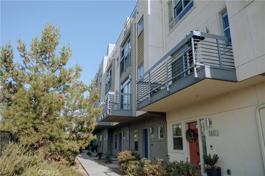 Incredible tri-level townhome with prime panoramic views of Atwater Village and the LA River at the Latitudes community in Silver Lake/Ivanhoe school district. This home features three bedrooms, two-and-a-half bathrooms. Upon entry, you'll find a versatile flex room on the first level, perfect for a home office or gym. The second level boasts an open-concept floor plan with a sun-drenched living area, balcony with views, kitchen, and dining area. Complete with large windows, high ceilings, recessed lighting, hardwood flooring, a center island, stainless steel appliances, this level also has a laundry room and powder room. The third level offers three generous bedrooms and two full bathrooms, providing ample space for family or guests. The master bedroom comes upgraded with soundproof window panes and a custom mirrored sliding door. Various other upgrades throughout the home, including tasteful velvet curtains, premium window treatments and hardwood floors throughout. Delight in the outdoors on the rooftop patio with beautiful sweeping views from both directions and an open entertaining space. The unit has an attached 2-car garage with direct entry into the first level. The orientation of the home is elevated above street, with an unobstructed frontage and dedicated entry path, thus providing privacy and stunning views. This securely gated complex offers a community pool and spa for your relaxation and enjoyment and guest parking. Located within a good school district, conveniently located across from Play Preschool, and close proximity to Atwater, Silver Lake, Griffith Park, shops, restaurants, and downtown LA. Don't miss out on this incredible opportunity! Please note, listing photos have been virtually staged.