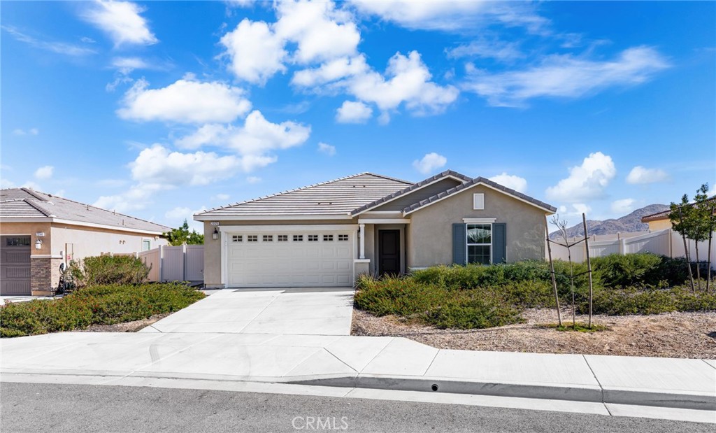 Welcome to 23125 Park View Court, a beautiful turnkey 3-bedroom 2-bathroom home nestled on a quiet cul-de-sac and surrounded by scenic mountain views. Inside, you'll find a spacious and bright open layout designed for modern living. The large kitchen is a standout feature with an oversized island perfect for bar stool seating, a walk-in pantry with upgraded wood shelving, sleek quartz countertops, soft close cabinets, and a premium electric dual oven. The home also features built-in surround sound speakers creating a seamless audio experience for relaxing or hosting guests.
The spacious primary bedroom offers a true retreat, complete with a spa-like ensuite bathroom with a double vanity, walk-in glass shower, and separate soaking tub. The expansive primary walk-in closet is designed for maximum organization and storage.
Step outside to enjoy a fenced-in backyard that feels like your own private resort. A sparkling in-ground jetted spa/dipping pool is perfect for cooling off or winding down. The covered patio provides a comfortable space for outdoor dining or lounging, and low-maintenance artificial turf keeps the yard looking green year-round. Entertain with ease using the built-in gas barbeque and cozy up by the custom built-in gas fireplace on cool evenings.
Conveniently located near shopping, dining, parks, major freeways, and top-rated schools, this home offers comfort, style, and thoughtful upgrades throughout. Additional highlights include smart home technology, soft water system, rolling shades, and exterior outlets for holiday lights. The paid-off solar system offers long-term energy efficiency and savings. With its upgraded features, ideal location, and move-in-ready condition, this home truly stands out as a rare find in Moreno Valley.