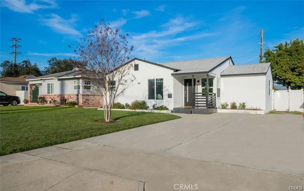 This 3-bedroom, 2-bathroom residence has been thoughtfully updated with a brand-new kitchen, stunning new flooring, and stylishly renovated bathrooms. Enjoy the comfort of central air and heat, ensuring year-round comfort. The house has plenty of driveway parking and a lush backyard. In the rear is a private ADU (separated with a fence) - 2 Bed / 1 Bath space that features its own garage and laundry in-unit (to be leased separately or along with the front house at a different rate). Don't miss the opportunity to own this turnkey property with endless possibilities!