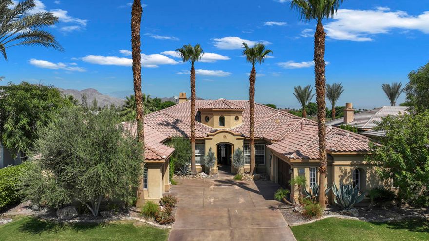 This fully REDONE Ventana model home is the epitome of upgraded relaxed luxury with gorgeous touches of quality & elegance! The premium lot offers Breath taking majestic mountain views and colorful sunsets overlooking multiple unobstructed lush fairways.  The expansive patio with sparkling pool & spa, has built-in BBQ, dining area, outdoor living & lounging space, excellent for entertaining family & friends! You will marvel at the beautiful features such as the dramatic 18 ft. rotunda entry accented by  luxurious lighting fixture, elegant lighting fixtures are accents throughout this stunning home.  The French White Oak Plank flooring has a marble inlaid medallion in the foyer and the plank flooring in the living areas brings the relaxed vibe throughout. The popular Ventana floor plan has 4 bedrooms (one of which is the casita). Guest ensuites with media room are located on the opposite wing of the home from the oversized luxury primary suite. All the baths are upgraded with marble counters and custom cabinetry. The  Guest Casita has it's own private courtyard entry door and a slider for pool & spa convenient access without having to go through the main house. The gourmet kitchen is the arena for the culinary arts ;the oversized marble prep island with customized cutting surfaces are great for a myriad of chef prep functions and Excellent space to showcase your culinary creations for serving and entertaining! The stainless appliances include a Professional Thermador gas cook top with 4 burners and center griddle. Double oven and warming drawer, chef's sink and a side by side 48' refrigerator with door ice and water dispenser. Highly customized cabinets complete this beautifully organized Dream Kitchen.  The floor plan's open airy design with soaring ceilings merges with the amazing great room surrounded by dramatic windows and doors to take in the views. The focal point of the floor to ceiling stone fireplace lures you into the comfortable living area with it''s own marble wet bar with  seating and a convenient wine fridge.  The custom wine room is strategically located in the hall for insulated temperature control and away from sunlight for the wine enthusiast's treasured wines. The center great room has a spacious dining area and another casual dining niche in the kitchen. The custom built-in office has artful distressed doors enclosing shelving and storage space, coffered ceiling & daytime lighting. VIEW, VIEW, VIEW wherever you are in the great room