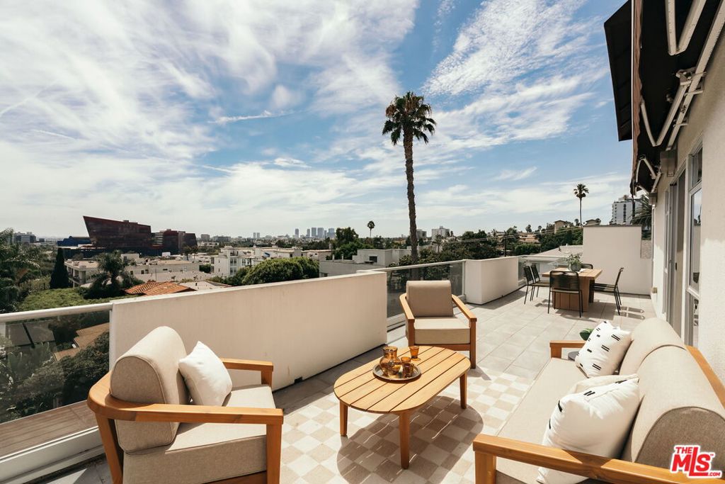 The Jewel of West Hollywood. Opulence hardly describes this one-of-a-kind masterpiece. A private elevator opens directly into the residence, where soaring ceilings and walls of glass create a light-filled, expansive living space. The showstopping 40-foot terrace is an entertainer's dream, offering magical sunsets and sweeping city views that stretch across West Hollywood, Century City, and beyond. This residence features two spacious en-suite bedrooms, including a luxurious primary suite with a tranquil sitting area and fireplace - your own private retreat. Both bedrooms are designed for comfort and privacy, perfectly balancing elegance with functionality.Designed with both sophistication and warmth, this home delivers a seamless blend of indoor and outdoor living. Moments from world-class dining, shopping, and nightlife, this rare offering defines city living at its most extraordinary.