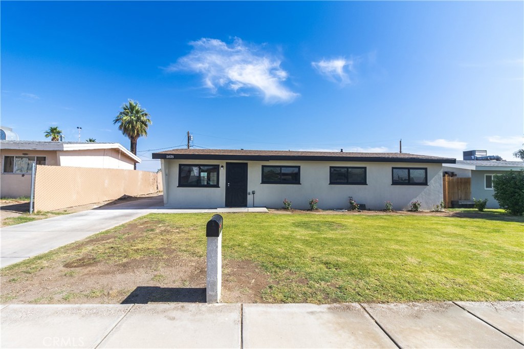 Step into this beautifully remodeled single-family home, featuring fresh interior and exterior paint and sleek modern finishes! The kitchen boasts large-scale tiled floors and beautiful matching countertops, complemented by brand-new white cabinetry and a new sink and faucet with a window overlooking the expansive backyard.
Enjoy durable laminate flooring throughout the spacious living area and bedrooms. The guest bathroom showcases contemporary design with elegant hexagon tile flooring that extends up the tub/shower walls. Both bathrooms are fully updated with new vanities, toilets, and modern fixtures. The master suite offers a luxurious walk-in tiled shower.
Additionally, this home features new exterior stucco, LED recessed lighting, doors and door hardware and a new 4 inch main sewer line.
The home offers gated side parking with access from both the street and alley, providing convenience and privacy. The front yard is beautifully landscaped with grass and blooming rose bushes, all maintained by an efficient brand new irrigation system. The back yard is super spacious allowing for plenty of room for your new garage and or pool!
Don’t miss the opportunity to own this move-in-ready gem with designer touches throughout!