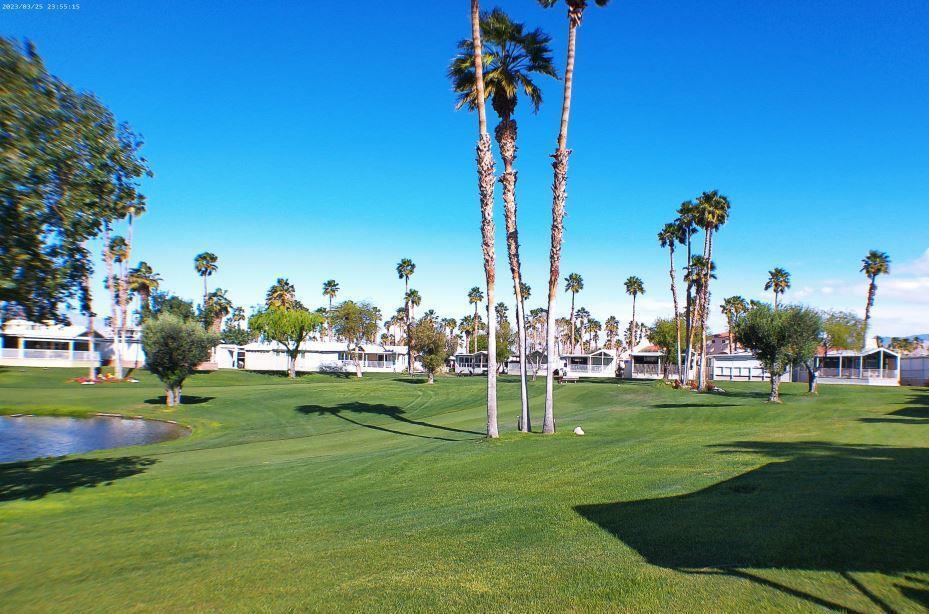 Location, Location! This Hallmark Park Model is located on the 10th Hole of the Rancho Casa Blanca Golf Course with views of the lake between the 1st & 10th holes, San Jacinto Mountains in the background. Sit on your raised , covered patio and watch the Beautiful sunsets and neighbors golfing on the 18 hole Par 3 course. This unit comes with a DW/ W/D, refrigerator and gas stove. Power Shutters are on 2 sides to provide protection from the winds and provide security also. Golf Cart is negotiable! Fully furnished and being Sold Turnkey. Don't miss this opportunity to enjoy the views.Rancho Casa Blanca (RCB) features a beautifully landscaped 80-acre property with 801 individual Park Model homes/or RV sites, Two large clubhouses that function as social hubs & 4 satellite buildings with laundry facilities, mailboxes, heated pools & relaxing spas. As an owner you will enjoy FREE GOLF on your 18-hole par 3 golf course, a 9-hole putting course, 2 practice chipping/putting greens, 6 heated pools/spas, 2 tennis courts, 8 pickle ball courts, shuffleboard courts, horseshoe pitch, fitness center & over 60 Clubs & Classes. This park has a limit of 270 day occupancy (not consecutive) out of 365 calendar year.