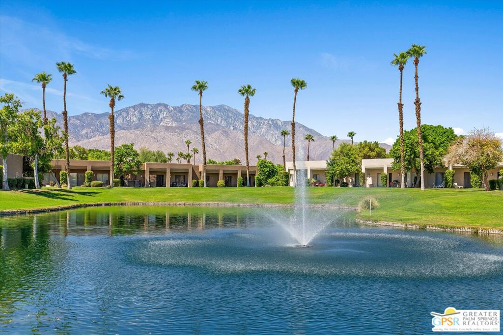 Offering spectacular views in virtually every direction, this bright and versatile condo presents one of the finest locations in Cathedral City's guard-gated Desert Princess community. Vast golf course and distant mountain views reflect in an expansive lake that shimmers just beyond the covered rear patio of this prime end-location residence, which also showcases dramatic Mount San Jacinto panoramas from its gated front courtyard. Views embellish interior living spaces throughout the one-level design, where three bedrooms and two upgraded baths await in approximately 1,285 square feet. Enjoy a bright living and dining area with lake views and patio access, and an updated kitchen with wood cabinetry, a built-in pantry, stone countertops, stainless steel appliances and a pass-thru bar to the living room. One secondary bedroom opens to the back patio, making it ideal for guests. Homeowners will appreciate a sliding-glass door, patio access and beautiful views in the primary suite, which hosts a walk-in closet, two sinks and a stone vanity top. Well maintained, the home is appointed with custom window coverings, crown molding, tile flooring, plush carpet in bedrooms, mirrored wardrobe doors, a stacked LG washer and dryer set, and a detached one-car garage. Desert Princess reveals a luxurious resort setting with numerous swimming pools, a 27-hole championship golf course, and a fully appointed clubhouse with restaurants for all occasions, a pro shop, spa, fitness center, and tennis and pickleball courts. A Hilton Double Tree hotel is located next to the clubhouse, and downtown Palm Springs, the Palm Springs International Airport, Rancho Mirage and abundant outdoor recreational attractions are moments away.