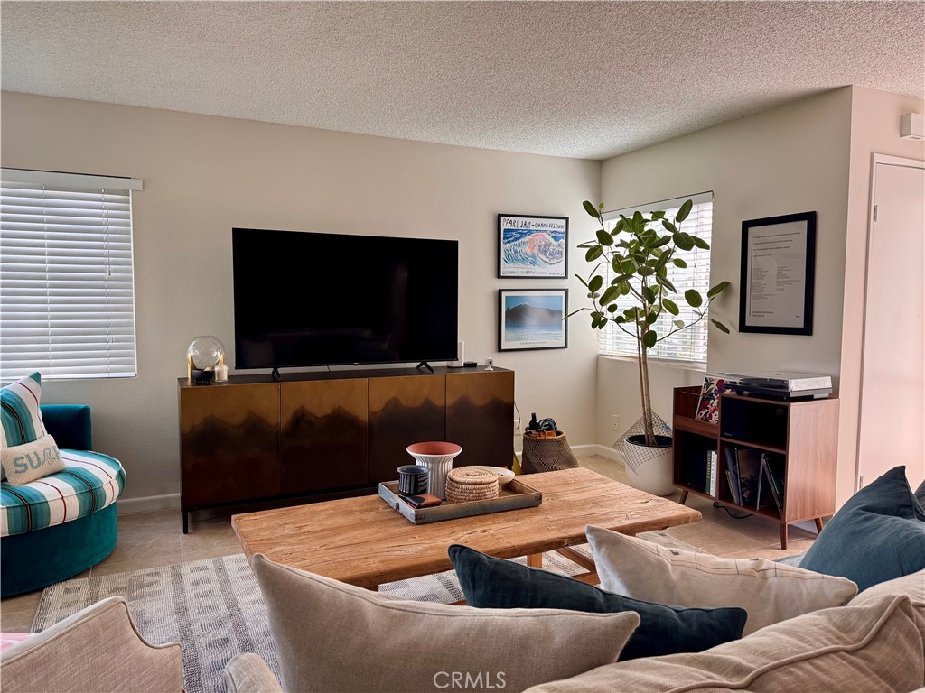 Welcome to your coastal haven in Dana Point! This 2-bedroom, 2-bathroom Niguel Beach Terrace condo offers a peek-a-boo ocean view and 1,022 square feet of indoor-outdoor living space. This charming condominium was recently improved with a full interior paint job, giving it a fresh and inviting feel.
You'll appreciate the tiled floor on the sheltered patio, which also includes a convenient storage closet, ensuring comfort and utility. The condo also features the added convenience of a washer and dryer located in the guest bathroom.
The HOA covers most utilities (excluding electricity), and you'll have access to fantastic community amenities like a pool, spas, clubhouse, and designated parking.
Location is everything! You're easily walkable to Strands Beach, perfect for a relaxing day by the ocean. Enjoy delicious meals in the vibrant Dana Point Lantern District and explore nearby attractions like Salt Creek Beach, the Ritz Carlton Resort, and the Dana Point Yacht Club. For further adventures, hop on the trolley to discover Laguna Beach, Doheny State Beach, and San Clemente. Dana Point's sunny climate, scenic trails, and diverse dining options are all at your fingertips