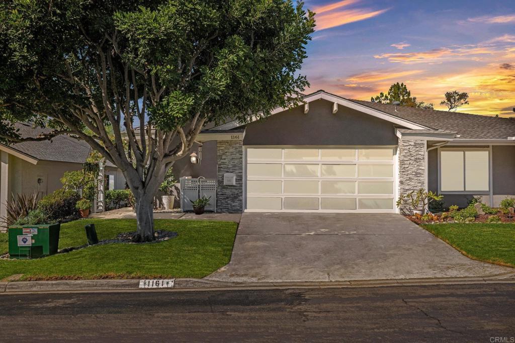 Nestled along the lush greens of The Executive Gold Golf Course—and just minutes from the sparkling waters of Lake San Marcos—this beautifully renovated home offers the perfect blend of luxury, leisure, and location. A grand double-door entry sets the tone, opening into a spacious living area with soaring vaulted ceilings, expansive windows, and abundant natural light. At the heart of the home, a floor-to-ceiling brick fireplace anchors the open-concept living and dining spaces, where sliders on both sides lead seamlessly to the backyard. Step outside to a large patio overlooking the fairway—ideal for entertaining, relaxing with morning coffee, or enjoying serene sunset views. An alcove off the main living area creates the perfect nook for a home office or reading retreat. The completely remodeled kitchen shines with crisp white cabinetry, brushed gold finishes, a stylish tile backsplash, recessed lighting, and premium stainless steel appliances. The primary suite is a true retreat, featuring vaulted ceilings, a cozy fireplace, and direct patio access. The spa-like ensuite offers marble countertops, dual sinks with vanity space, a tiled shower/tub combo, and a custom walk-in closet. A spacious guest bedroom and an updated guest bath with a Velux skylight provide comfort and privacy for family or visitors. Additional upgrades include a new roof and gutters, new HVAC, tankless water heater, epoxy garage flooring with new garage door, and even an infrared sauna for wellness at home. With no neighbors across the street, peace and privacy come standard. The community offers a sparkling pool, relaxing spa, tennis and basketball courts, a clubhouse, and fitness center—all with easy access to the fairways and Lake San Marcos. Here, every day can be as active or as laid-back as you choose, whether teeing off in the morning, taking a dip in the afternoon, or strolling around Lake San Marcos at sunset. With shopping, dining, and top-rated schools nearby, this home offers everything you need!