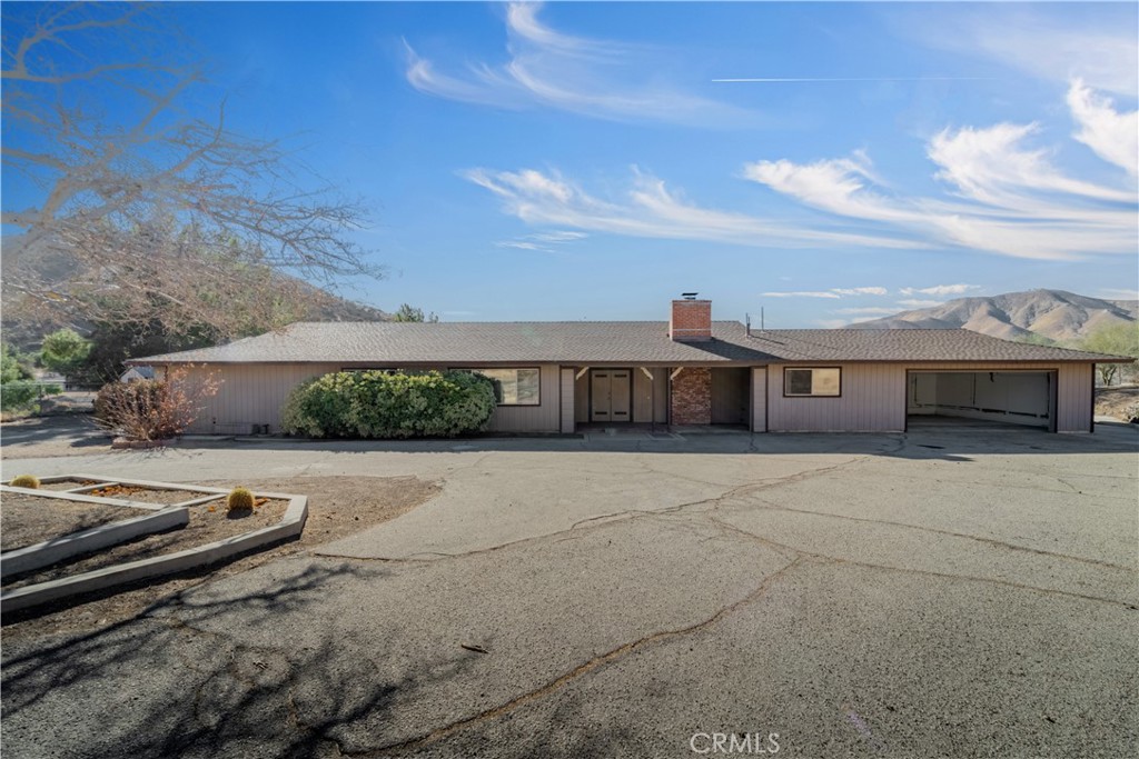 Great opportunity to own an Acton home with stunning views! Situated on approximately 2.5 acres, this single-story ranch-style home, complete with a private gated entrance, features 4 bedrooms, 2.5 bathrooms, and an open-concept floor plan. The spacious living room includes a fireplace, and there is a dining area off the kitchen, along with a second living room. The kitchen offers ample counter space, perfect for preparing your favorite meals, along with a large laundry room and a 2-car attached garage. Enjoy breathtaking sunsets and mountain views right from your backyard. Don't miss out on this incredible property—schedule a visit today!