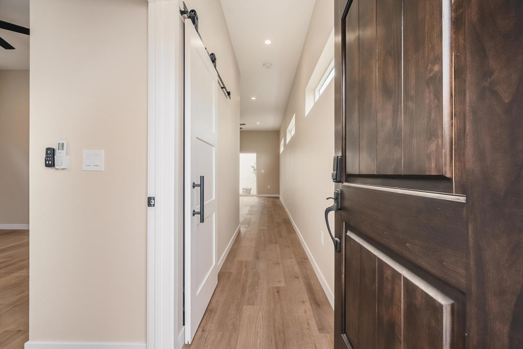Newly constructed privately gated stand-alone accessory dwelling unit boasting one bedroom, one bathroom, 10 feet high ceilings, all new appliances, pristine white kitchen cabinets housing two sets of lazy-susans, a spice rack, floor to ceiling cabinetry, and luxurious quartz countertops, remote controlled mini-split HVAC units and remote operated ceiling fans in both living area and bedroom. The house features 680 square feet of well-designed living space with clerestory windows permeating abundant natural light. Appliances include laundry washer and dryer, French door refrigerator with water and ice dispenser, microwave, electric oven range with air fry feature, and a dishwasher. Shower showcases thoughtfully designed niches, rain and handheld shower heads. Abundant storage and closet space including a coat closet by the entry door and fully mirrored bedroom closet sliders. Living room sliding door leads to a backyard with a wraparound walkway to yet another sitting area near the entry. Solar system installed. Recessed lighting and vinyl plank flooring throughout with stone flooring in the restroom. To top it off, there's a fruitful pomegranate tree in the yard. Tenant only pays electric utility. Water is included in rent. If interested in renting the house as a furnished midterm or long term rental, please inquire with listing broker.Property is located in the desirable historic Rossmoyne neighborhood of Glendale with easy access to the 134, 2, 210, 118, 110, 5 freeways and near public transit. Minutes to downtown Los Angeles, JPL, the Americana at Brand, Burbank, Glendale Adventist Hospital, USC Verdugo Hills Hospital, and Dignity Health.