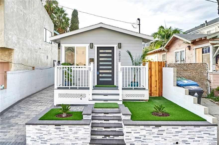Welcome to your dream coastal retreat, just a hop, skip, and a jump away from the sparkling shores of Cabrillo Beach and the iconic Point Fermin lighthouse. This stunning Craftsman California Bungalow has undergone a top-to-bottom renovation, leaving it as fresh and fabulous as a sea breeze on a sunny day. Step inside this 2-bedroom, 2-bathroom haven, and you'll be greeted by an open floor plan that's perfect for modern living. It's practically a brand-new home, with everything from the foundation to the roof freshly redone. The magic continues with new flooring, dual-pane windows that let in the sunshine, and sleek fixtures throughout. The kitchen is a chef's delight, boasting quartz countertops and shiny stainless steel appliances that practically beg you to whip up some beachside feasts. This home is all about the extras. Picture yourself basking in the glow of recessed lighting, stepping onto cool tile in the bathrooms, or enjoying the perfect temperature thanks to ceiling cassette mini-splits that keep you comfy year-round. And don't forget the washer and dryer hookups - laundry day just got easier. Front and back porches are the ideal spots for sipping morning coffee or watching the sunset. The eco-friendly landscaping, complete with lighting and automatic sprinklers, adds a touch of magic to your outdoor space. The long driveway with interlocking paver stones is not only practical but also stylish. And privacy is assured with the fully fenced backyard, the ultimate backdrop for your next gathering with friends and family. But the excitement doesn't stop there. You're just minutes from Cabrillo Marina, Cabrillo Beach, Ports O’ Call Village, and the future $100 Million Dollar LA Waterfront Development Project - West Harbor. With easy access to all that Point Fermin has to offer and a hassle-free commute, this is beachside living at its finest. Don't miss your chance to make this coastal gem your own - it's the beach house you've been dreaming of!