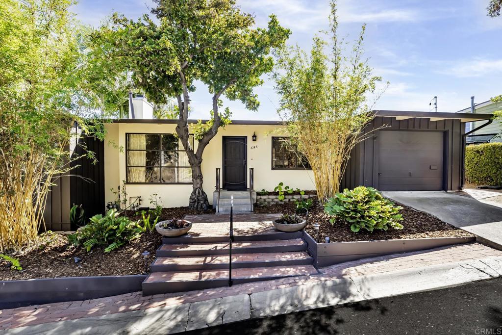 This charming home features an enchanting original Mid-Century vibe (circa 1951) full of deep, rich wood tones, open beamed wood ceilings, tile and refinished hardwood flooring, updated paint, multi-level interior atrium and an array of complementary international design features. The residence’s modern alterations blend seamlessly with its original details. Each bedroom features an updated ensuite three-piece bathroom. The ultra-private lower-level primary bedroom opens out to the terraced side and backyards, perfect for your private morning cup of coffee. The terraced patios are perfect for barbecues, relaxing and gatherings. They are nestled by the cascading fountain, luscious landscaping, fruit trees and captures delightful canyon breezes with incredible sunset views. Features lovely front yard up-lighting and drip irrigation, just minutes from the vibrant SDSU campus.