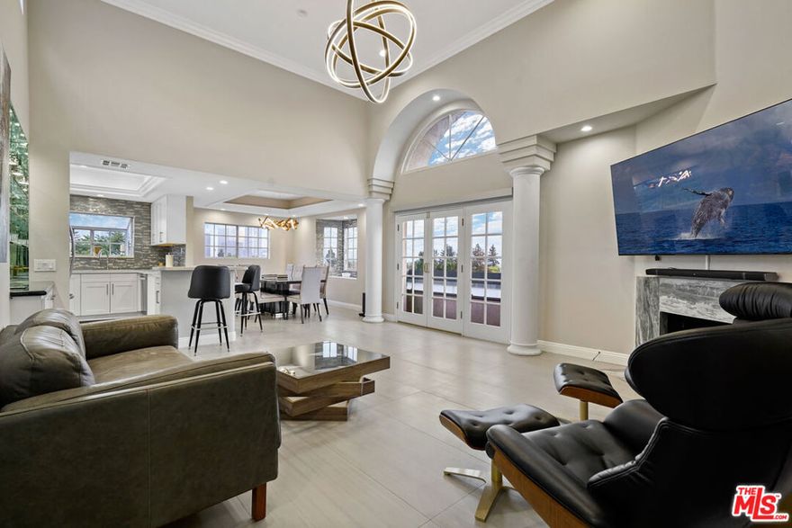 Gorgeous top-floor 2-bedroom, 2-bath penthouse in prime Westwood, offering soaring ceilings and sweeping city views. This light-filled home features a stunning remodel throughout, including a chef's kitchen with stainless steel appliances and sleek cabinetry, plus designer bathrooms highlighted by an oversized primary shower. Enjoy the convenience of two side-by-side parking spaces, a private storage room, and an electric vehicle outlet in the secure garage. Ideally located moments from UCLA, Century City, and Westwood Village, this residence combines luxury, comfort, and convenience in one of L.A.'s most sought-after neighborhoods.