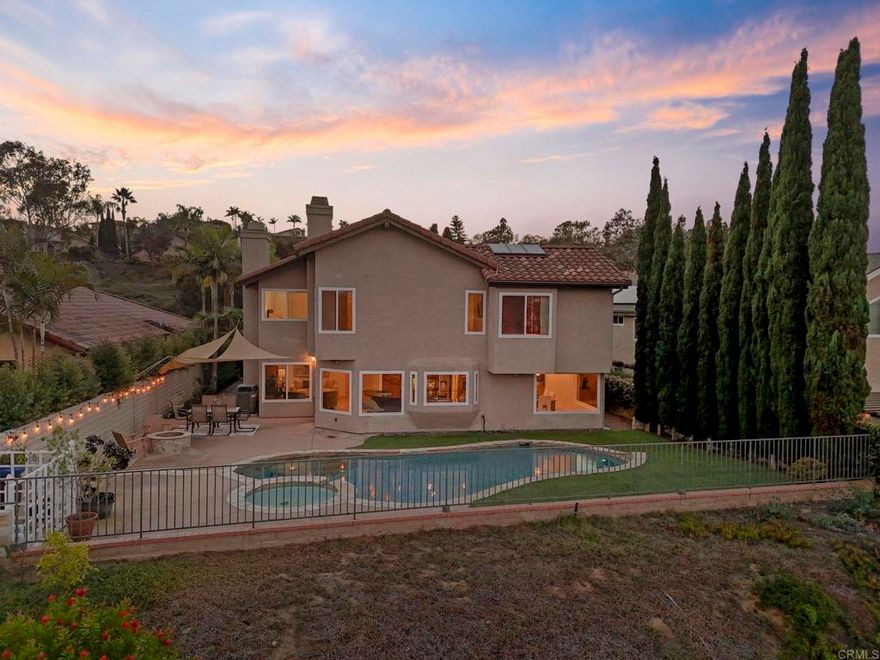 Ideal Location in Encinitas! Situated in the highly sought-after Cantabria community, this beautifully remodeled home offers panoramic mountain and hillside views and elegant upgrades throughout. The gourmet kitchen features granite countertops, upgraded cabinetry, and stainless steel appliances, opening to spacious living areas with travertine and hardwood floors, vaulted ceilings, skylights, and a cozy gas fireplace. A stunning wrought iron staircase adds architectural charm. The home offers 5 bedrooms and 2.5 baths, including a downstairs bedroom perfect for guests or an office. Upstairs, the primary suite showcases high ceilings, mountain views, a fireplace, a custom built-in closet, and a luxurious en-suite bath with a soaking tub, separate shower, and dual-sink vanity. Three additional bedrooms and a dual-sink bathroom complete the upper level. Enjoy the low-maintenance yard with attractive hardscape, turf, an oversized pool and spa, and a fire pit—perfect for entertaining or relaxing while taking in the valley and mountain views. Additional features include a three-car garage with epoxy floors, newer water heater, crown molding, recessed lighting, and custom built-ins. Community amenities include a pool, spa, and two lighted tennis courts. Conveniently located just 2 miles from the beach and I-5, near top-rated schools, shopping, dining, and healthcare. Easy access to Home Depot, Target, Walmart, The Forum, and recreational activities like tennis, pickleball, and swimming.