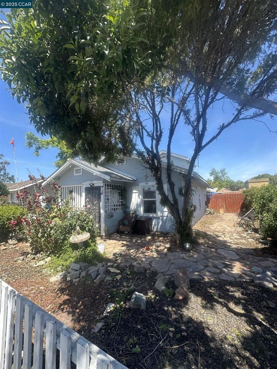 Great starter home or investment , adu potential back storage/ was garage was sed years ago as a rental by owners grandparent who he does not believe is permitted currently used as storage .  Large lot new roof 2024 front house , roof on detached garage new 2019 . Newer flooring throughout  installed 2020 . new widows. washer dryer hock up , stove, refrigerator ,  This home qualifies for 100 percent financing  its in a census track special criteria applies. priced to sell.short distance to restaurants stores. Near freeway and bart. vacant now with lock box go direct.