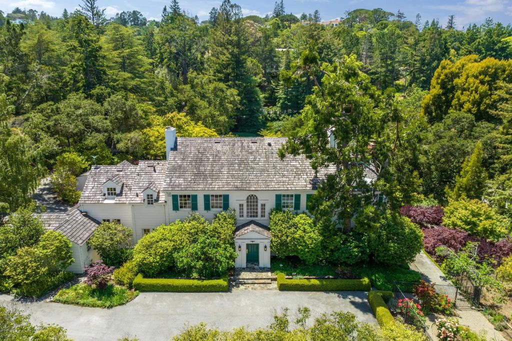 Nestled in the heart of the prestigious community of Hillsborough, this secluded retreat offers the ultimate in peaceful serenity. Uniquely located within minutes of vibrant downtown Burlingame, this hidden gem offers an impressive two story home and two separate guest quarters. This stately property boasts over two acres, a sun-drenched pool and spa, tennis court, rose garden, fruit orchard, nature trails and magestic specimen trees. Just moments from San Francisco International Airport, major transportation arteries and renowned public schools, this inviting home exudes warmth and comfort.This impressive estate offers six bedrooms and six and a half bathrooms, four bedrooms in the main home and two separate guest quarters, each with their own bedroom and bathroom. The dramatic living room and dining room are complemented by a remodeled kitchen, grand solarium, breakfast room and family room. Magnificent architectural details seen throughout. Outdoor brick patio with custom grill.
