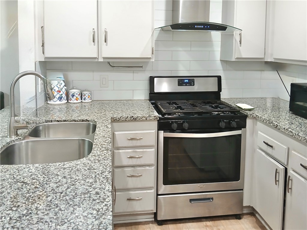 This townhouse condominium offers 980 square feet of well-designed living space! The open-concept lower level comprises kitchen, dining room, living room and a 3/4 bathroom. The remodeled kitchen is fully-equipped with a dishwasher, a double-basin stainless steel sink, and a gas stove, with granite countertops and a convenient breakfast bar. Relax in the living room with a pleasant window view of lawn and trees. Entertain/unwind in the private enclosed patio, accessible from the dining room slider. The upper level consists of 2 bedrooms with plenty of closet space, a stacked washer/dryer laundry closet and a modern, full bathroom with tiled tub and shower. Neutral, plank laminate flooring flows throughout. This home also includes a reserved carport parking space and storage closet, central heating and AC, a swimming pool and a large children’s pool. $370 monthly HOA. Conveniently located in the Sagepointe neighborhood near great schools, shopping, restaurants and public transit. See it! Love it! Make it yours! *All information is deemed reliable but is not guaranteed by agent or broker.