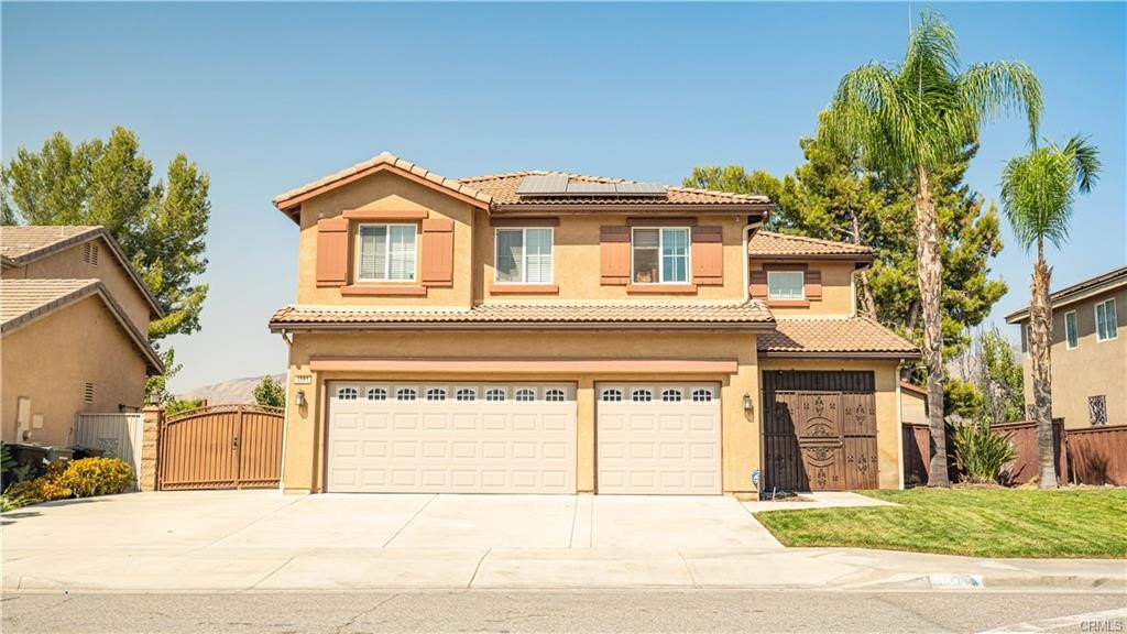 Welcome home to 1551 Yeats Place in a newer neighborhood in San Jacinto. FHA OK! Quick move-in OK! This better-than-new, 5-bedroom, 3-bathroom, 3,274-square foot home built in 2005 has been beautifully upgraded with tile and high-end laminate flooring throughout the home - not a stitch of carpet remains! Granite tile tops the kitchen counters and island. The family room boasts a beautiful, built-in media cabinet, cozy fireplace, and built-in speakers. There's a downstairs bedroom and 3/4 bath perfect for long- or short-term guests. The super-sized loft is a great hangout for the whole crowd with space for a beverage fridge to keep drinks handy. The master suite features a double-door entry, jetted tub, separate shower, dual sinks, and dual closet access. Crown moulding and wainscoting in many of the rooms help to highlight the custom paint. Tech lovers will enjoy the security system and intercom. RV owners will love the gated RV parking with a concrete pad and 50 amp hook-up. Out back, there's a covered patio, a separately gated dog run, and a large storage shed. This home is in near-new condition inside with great concrete work already in place in the back yard.