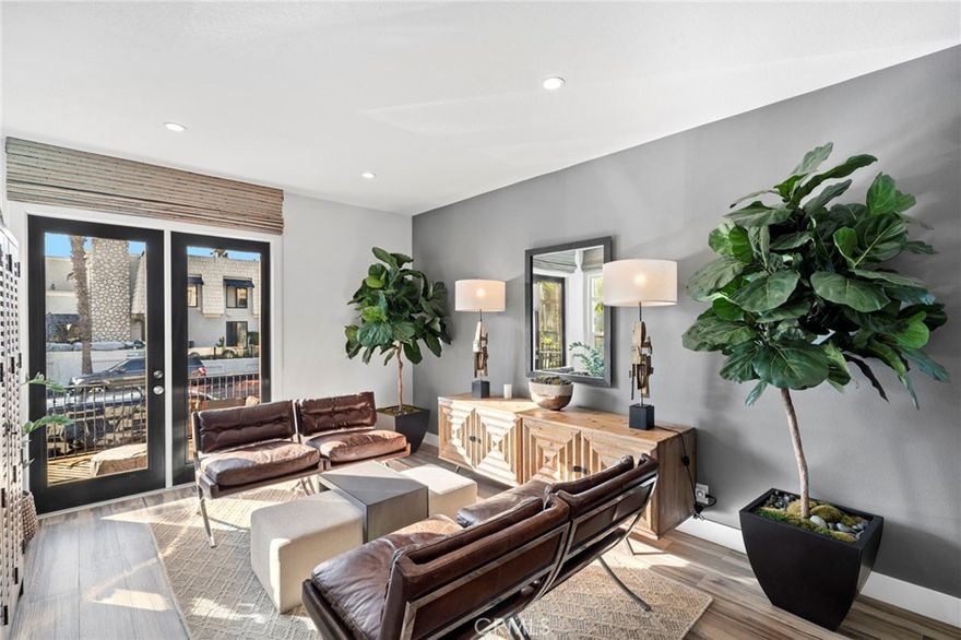 Welcome to 310 18th Street - an elegantly remodeled and fully furnished beachside residence in the heart of Downtown Huntington Beach. Just moments from the shoreline, Pacific City, and the iconic Huntington Beach Pier, this detached single-family home blends timeless design with modern convenience across 2,462 square feet of coastal-inspired living space. Step inside into a light-filled living area featuring porcelain wood tile flooring and a seamless indoor-outdoor connection to the front patio with ocean breezes - perfect for entertaining or soaking in the coastal atmosphere. The open-concept layout flows effortlessly from the living room to the dining area and kitchen, ideal for relaxed gatherings or elevated everyday living. This thoughtfully designed home features three spacious bedrooms and three and a half bathrooms, including a convenient half bath on the first floor - perfect for guests. Upstairs, each full en suite bathroom has been custom-designed with its own distinctive finishes, while the primary suite offers a peaceful retreat. After a day at the beach, rinse off in your private outdoor shower before heading up to the rooftop deck, where coastal breezes and sunset skies invite relaxation. A two-car garage provides secure parking and extra storage. Offered fully furnished, this home is move-in ready and perfect as a primary residence, second home, or luxury rental. Live the ultimate surfside lifestyle - just three blocks from the beach, world-class surf, trendy shops, and acclaimed restaurants. This is Huntington Beach living at its finest.