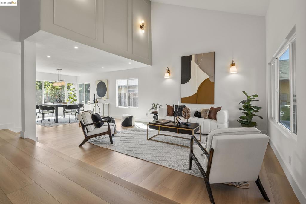 This stunning, extensively renovated 4-bed, 2.5-bath home offers modern living on a serene cul-de-sac. Upon entry, you’ll be captivated by soaring cathedral ceilings and an abundance of natural light. The open-concept living and dining areas flow seamlessly to the kitchen, featuring sleek cabinetry, quartz waterfall countertops, a breakfast bar, and stainless-steel appliances, including a smart Café induction oven. The connected family room boasts an elegant fireplace, half-bath, and sliding doors for easy access to outdoor entertaining. Upstairs are three bedrooms, a full bath, and a spacious primary suite with vaulted ceilings, abundant closet space and a luxe double-sink bathroom. The 7,800+ SF lot is your vision in the making: a play structure, garden beds, dog run, croquet area, or even an ADU—it’s all possible. Additional features provide convenience and comfort: an attached two-car garage, laundry room, coat closet & under-stair storage. Builder provides a 1-year warranty. Upgrades include new flooring, doors, hardware, recessed lights, double-pane windows, new furnace/AC and water heater, updated electrical & plumbing, interior/exterior painting. This coveted location is close to Weibel Elementary, BART, 99 Ranch and more shopping, multiple parks, and easy freeway access.