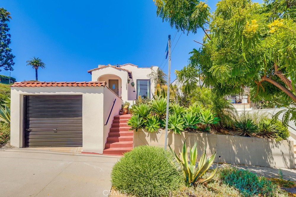Stunning Spanish-Revival Remodel — Elevated Charm & Smart Waterfront-Adjacent Investment
Step into timeless Spanish-style elegance in this beautifully remodeled 1920s home—where classic architectural details meet modern-day comfort. Perched gracefully above the street, the property greets you with a striking red-tiled staircase that leads into a bright, inviting interior featuring a harmonious blend of authentic Spanish tile and warm hardwood flooring.
Standout Features
3 Bedrooms | 2 Bathrooms | Indoor Laundry Room – Thoughtfully laid out for contemporary living
Private Rooftop Deck Possibility – A broad flat roof above the garage offers incredible potential for creating a scenic retreat or entertainment nook to enjoy the Harbor and Ocean View!
Charming, Low-Maintenance Backyard – A quaint garden with drought resistant plants, gazebo, and storage shed complete this peaceful outdoor space
Priced at $685,000, this turnkey gem represents an extraordinary value in today’s market. The San Pedro Waterfront is undergoing a dramatic transformation, anchored by West Harbor—a 42-acre premier food hall, open-air theater, Ferris wheel, shops, and eateries—slated to open by 2025.