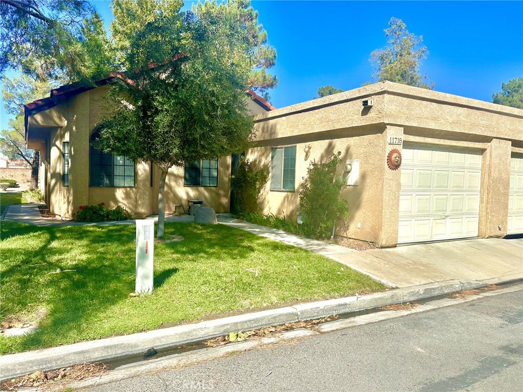 Welcome to this lovely spacious newly renovated split floor plan entailing 2 bedroom 2 bath home. This home has new carpeting and new laminate flooring throughout. The main bathroom features Double sinks with lots of built-in-drawers and a huge walk-in- closet. The tile shower has been completley redone to boast modern beauty. the kitchen is very light and airy as the breakfast nook is great to enjoy a meal or simply a good cup of coffee. The guest bathroom has an indoor laundry room attached and close to the guest bedroom with a walk-in-closet. The one car attached garage is extra deep for additional storage. Lots of greenery and a nice back patio with a small block wall, perfect for your pup.