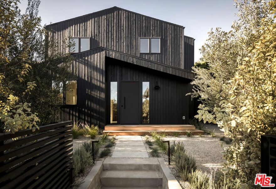 Tucked away on one of Venice's most desirable and peaceful streets, this newly crafted home blends timeless materials with modern California design. Nearly 2,500 SF of living space unfolds in a seamless balance of luxury and warmth, with wide-plank white oak floors, natural cedar siding, and custom designer finishes throughout. At the heart of the home lies a stunning custom kitchen featuring arbescato marble countertops, plaster walls, and bespoke custom white oak cabinetry with a fully integrated refrigerator, appliance garage, and Viking appliances. Bifold doors open effortlessly to a beautifully landscaped backyard framed by mature hedges, creating an ideal flow for indoor-outdoor living. Each of the four spacious bedrooms offers a private ensuite bath, with three featuring walk-in closets, while the primary suite boasts an oversized walk-in closet and a serene spa-like bathroom. A dedicated office provides space for creativity or quiet focus. Additional highlights include custom steel privacy gates, a walk-in pantry, and a detached two-car garage with alley access that is fully finished with epoxy floors, offering versatility as a studio, gym, or creative workspace. Just a short walk to Venice's iconic spots on Abbott Kinney and the beach, the home combines refined design, quality craftsmanship, and a premier Venice lifestyle.