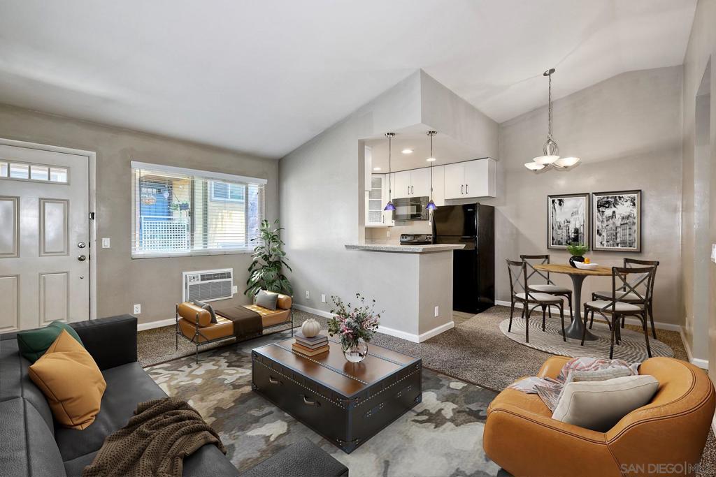 This charming upstairs unit boasts a spacious 1-bedroom, 1-bath open concept layout. Enjoy the airy feel of vaulted ceilings and the convenience of indoor laundry with a full-size washer and dryer included. The unit features air conditioning and a one-car garage. The gated complex is in close proximity to San Diego State, shopping, and dining.